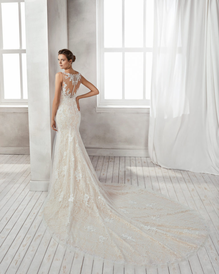 Mermaid-style beaded lace wedding dress with V-neckline, in nude and natural.