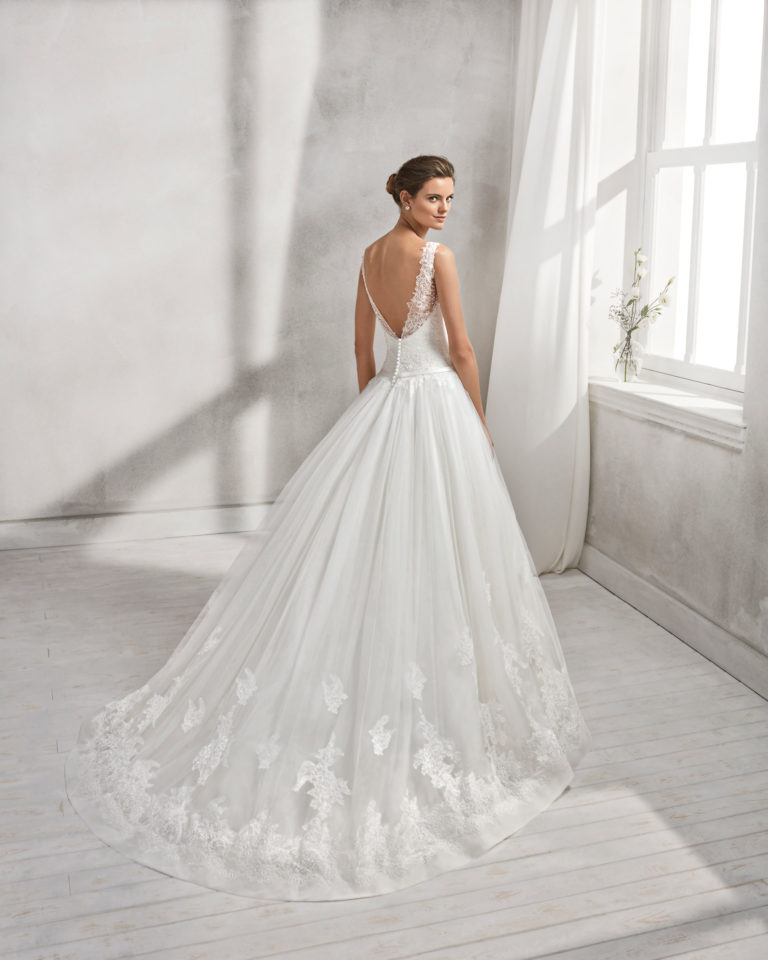 A-line beaded lace and tulle wedding dress with V-neckline and low back.