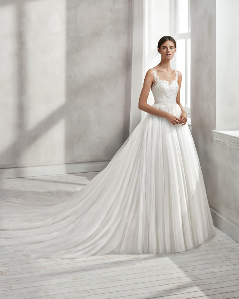 Princess-style beaded lace wedding dress with square neckline, low back and full tulle skirt.