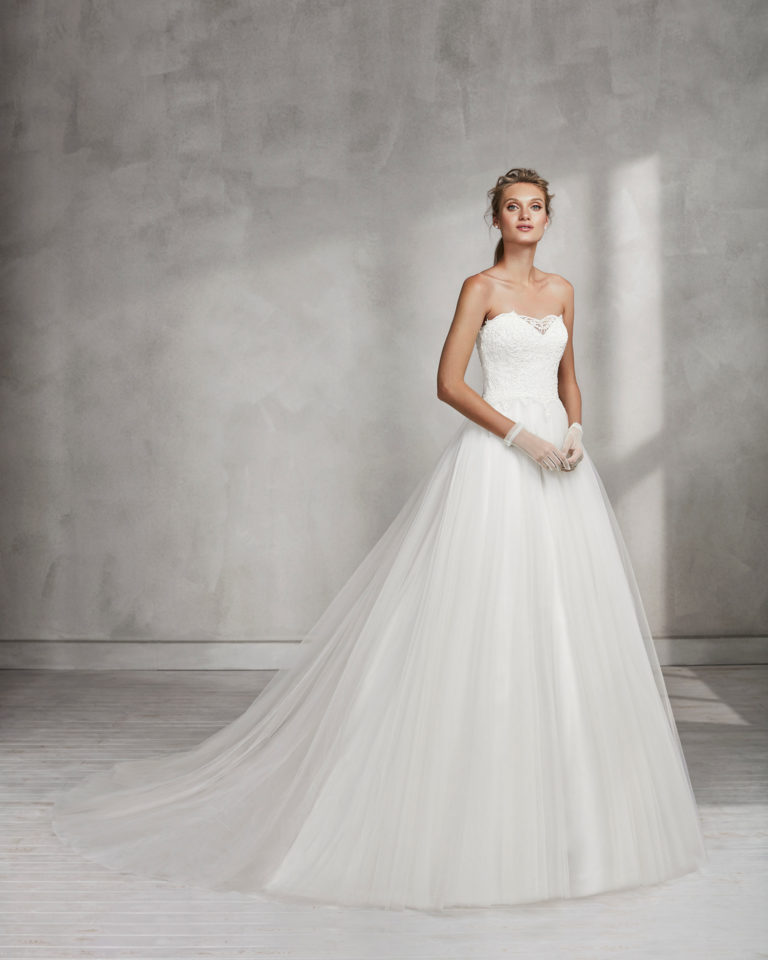 Princess-style beaded lace and tulle strapless wedding dress.