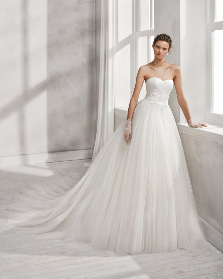 Princess-style beaded lace and tulle wedding dress with sweetheart neckline.