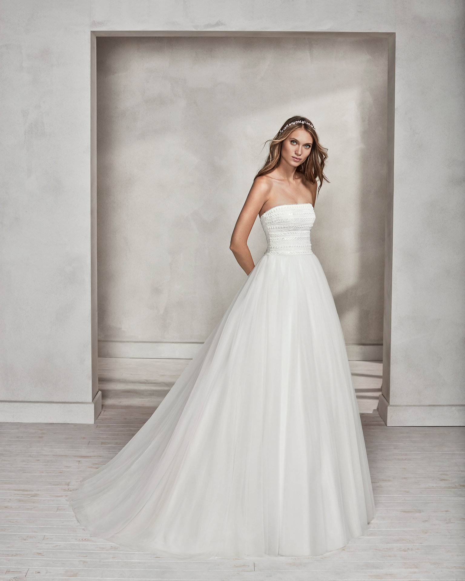 Princess-style beaded guipure lace and tulle strapless wedding dress.