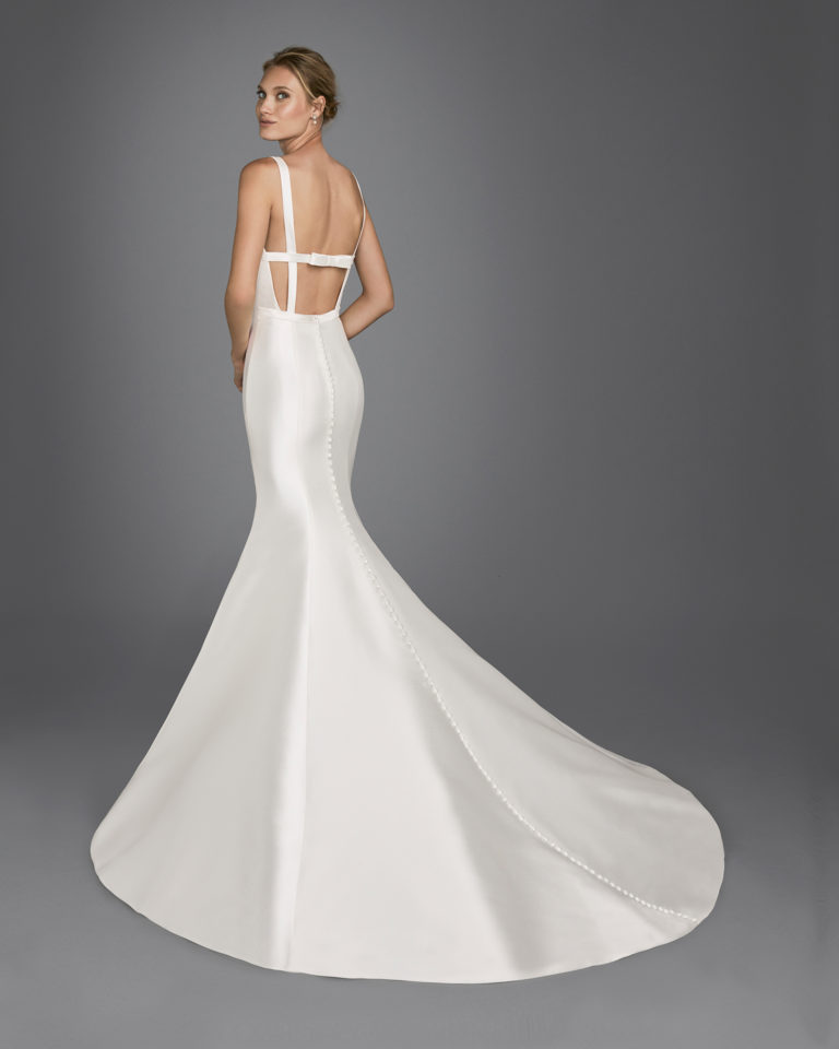 Mermaid-style mikado wedding dress with bateau neckline, open back and bow at rear.