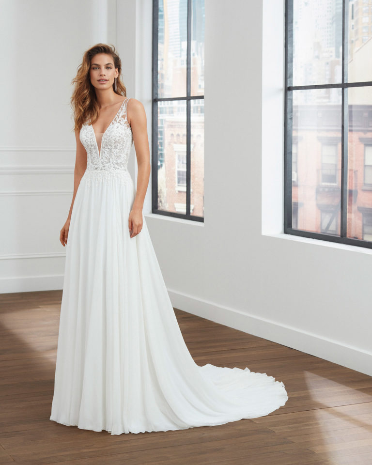 Peau d'ange voile wedding dress with pleats at the waist, deep-plunge neckline and back with sheer inserts. 2020  Collection.