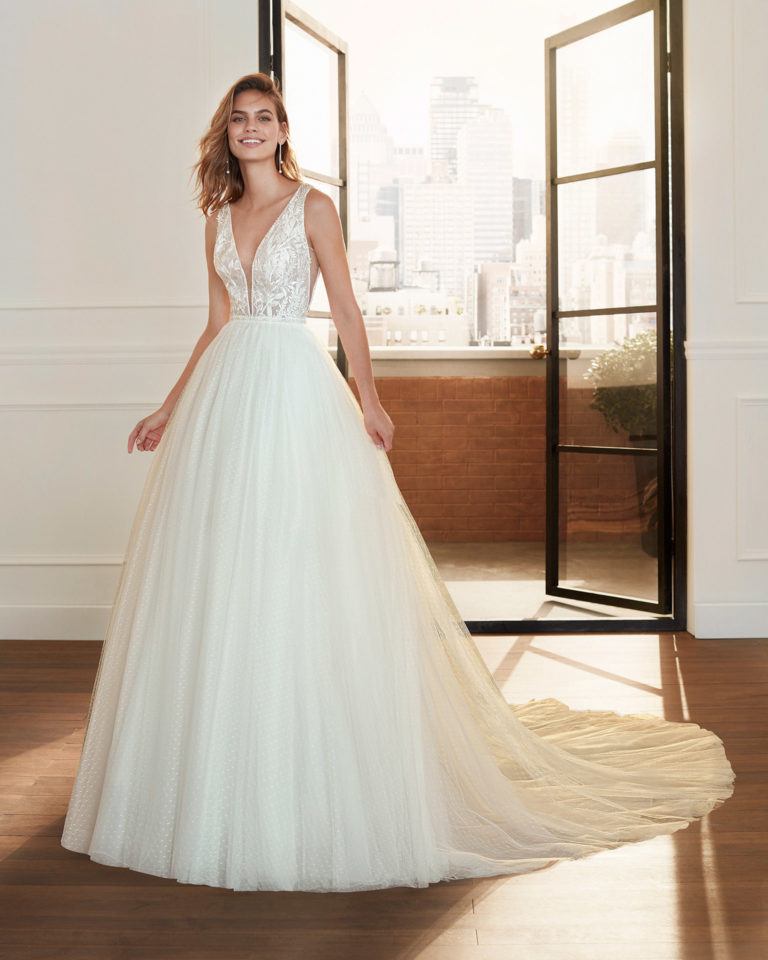 Romantic lace and dot tulle wedding dress with beading, deep-plunge neckline and V-back. 2020 Collection.