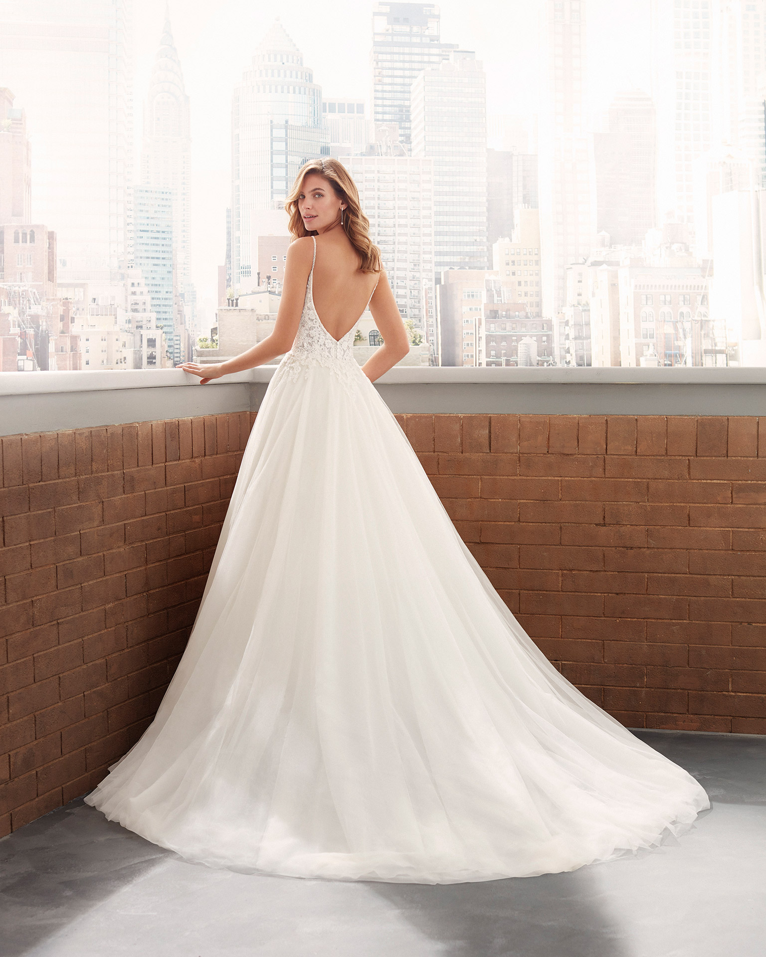 Romantic lace and soft tulle wedding dress with beading, deep-plunge neckline and low back. 2020  Collection.