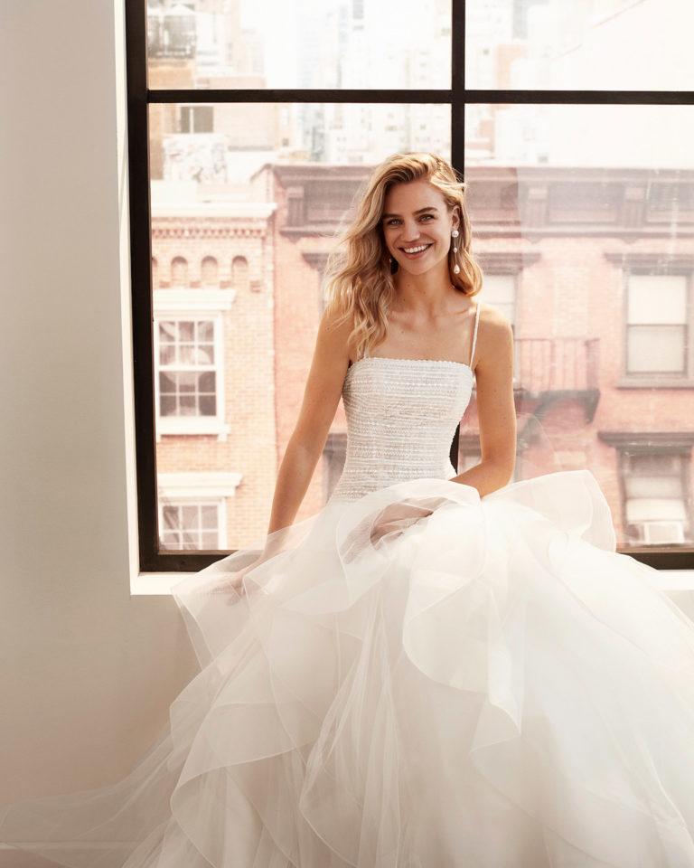 Strapless ballgown-style embroidered and beaded tulle wedding dress with flounced skirt. 2020 Collection.