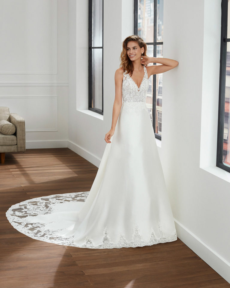 A-line corded lace and mikado wedding dress with V-neckline and back. 2020 Collection.