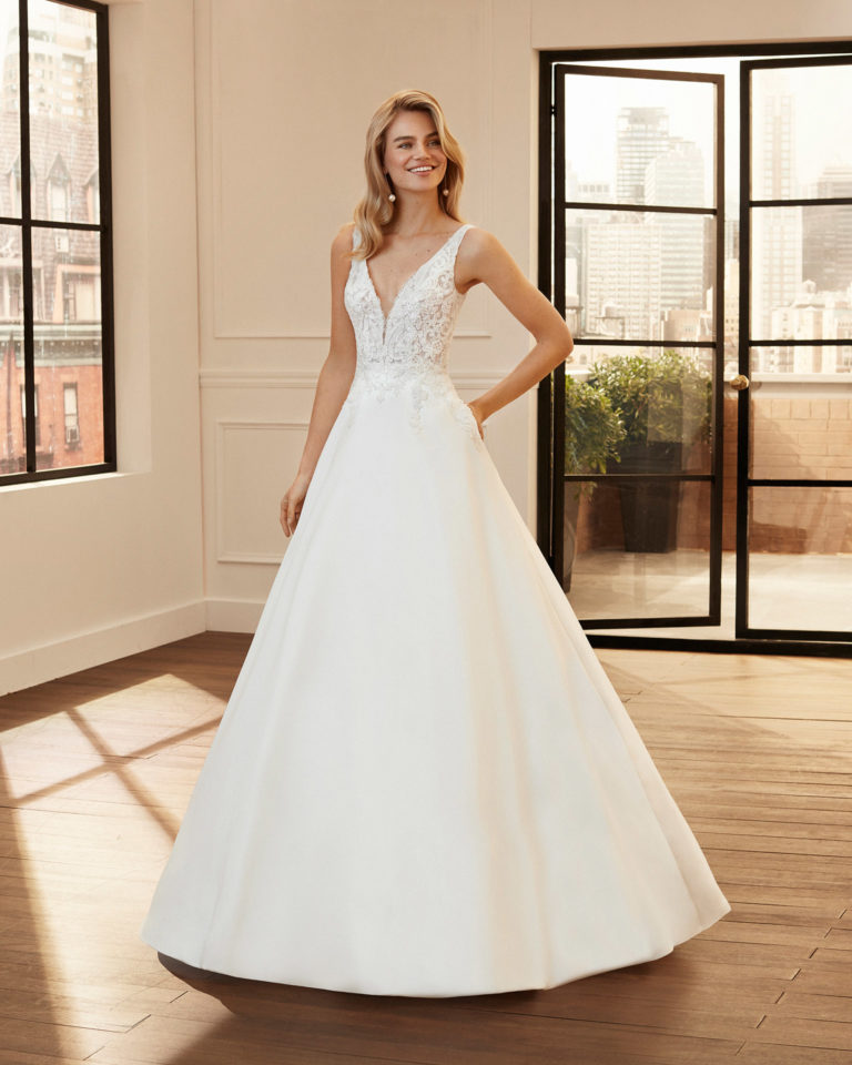 A-line lace and mikado wedding dress with beading and deep-plunge neckline and V-back. 2020 Collection.