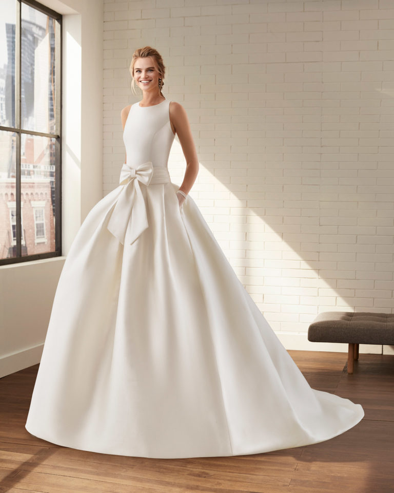 Classic ottoman wedding dress with bateau neckline and low back. 2020 Collection.