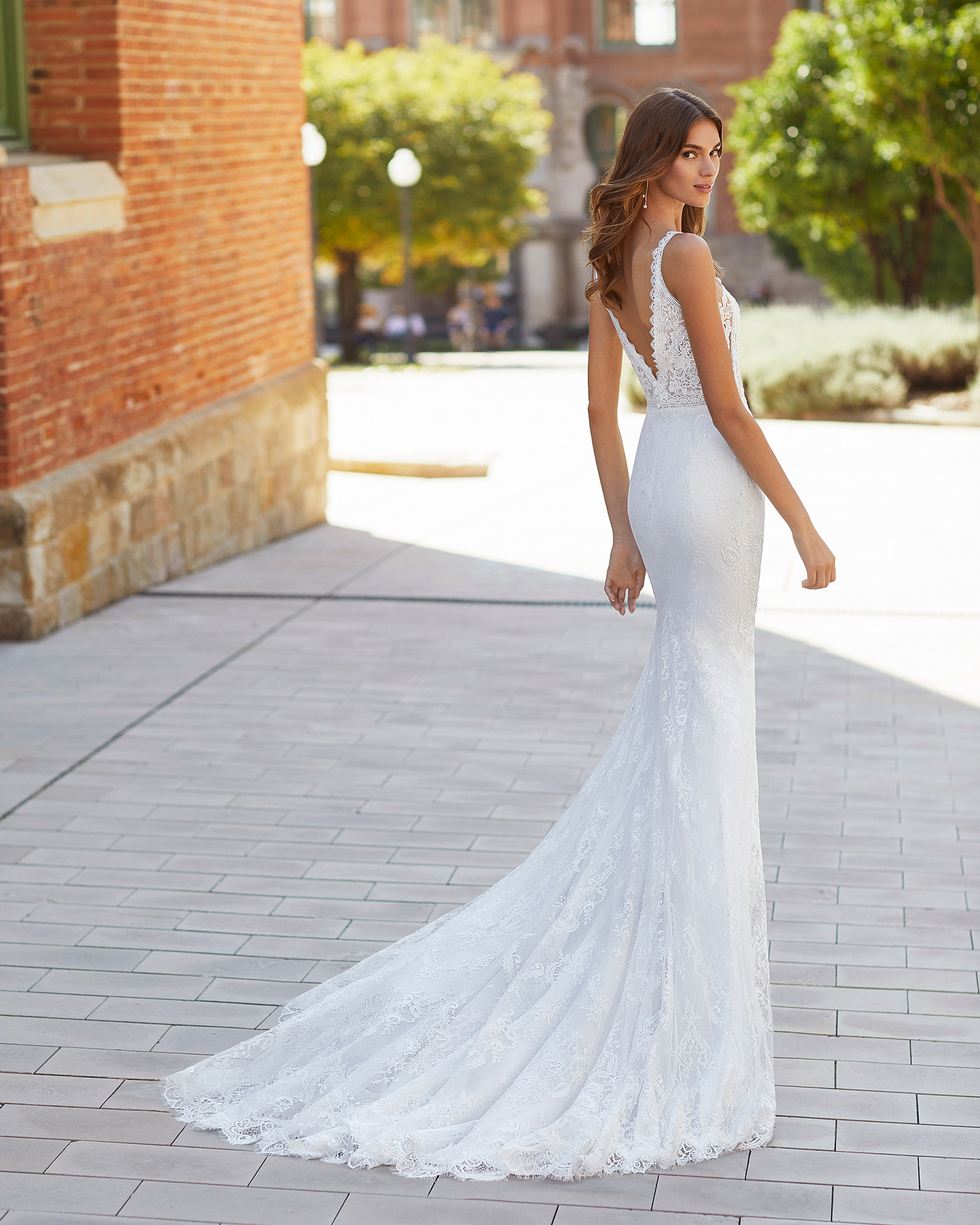 Mermaid-style wedding dress in stretch crepe and beaded lace. Deep-plunge neckline and V-back. 2021  Collection.