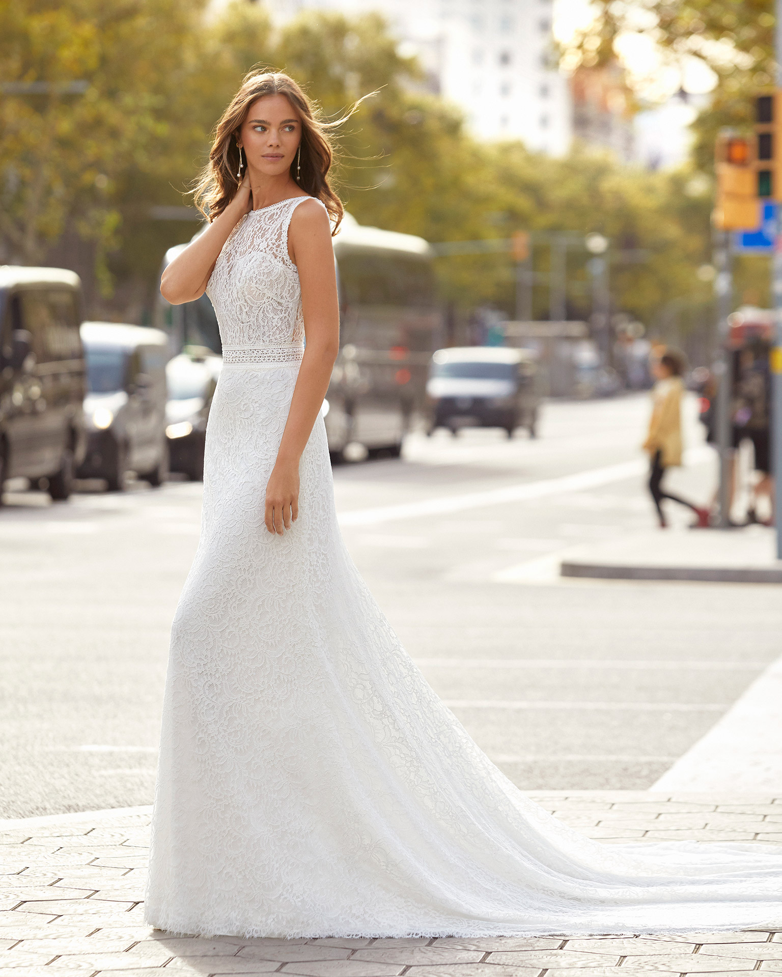 Sheath-style wedding dress in beaded lace. Bateau neckline with sweetheart underlay and V-back. 2021  Collection.