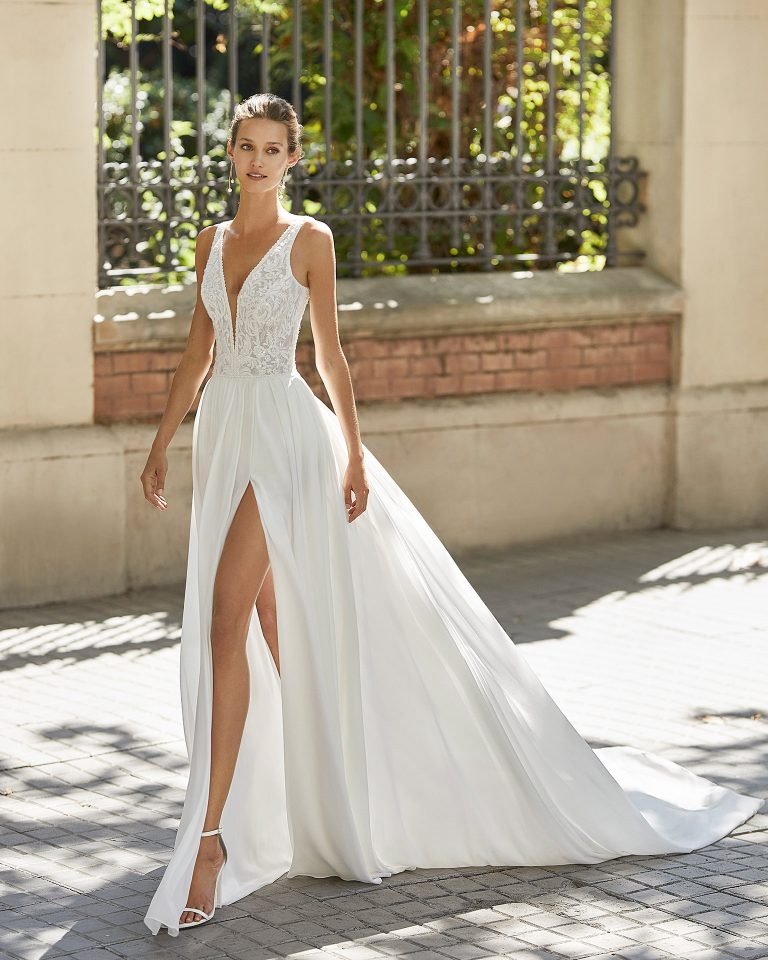 Lightweight wedding dress in georgette and beaded lace. Deep-plunge neckline and V-back. 2022  Collection.