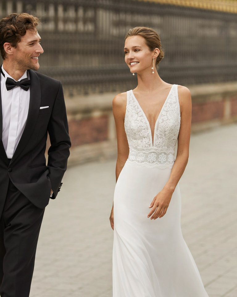 Lightweight wedding dress in georgette and lace. Deep-plunge neckline and V-back. 2022  Collection.