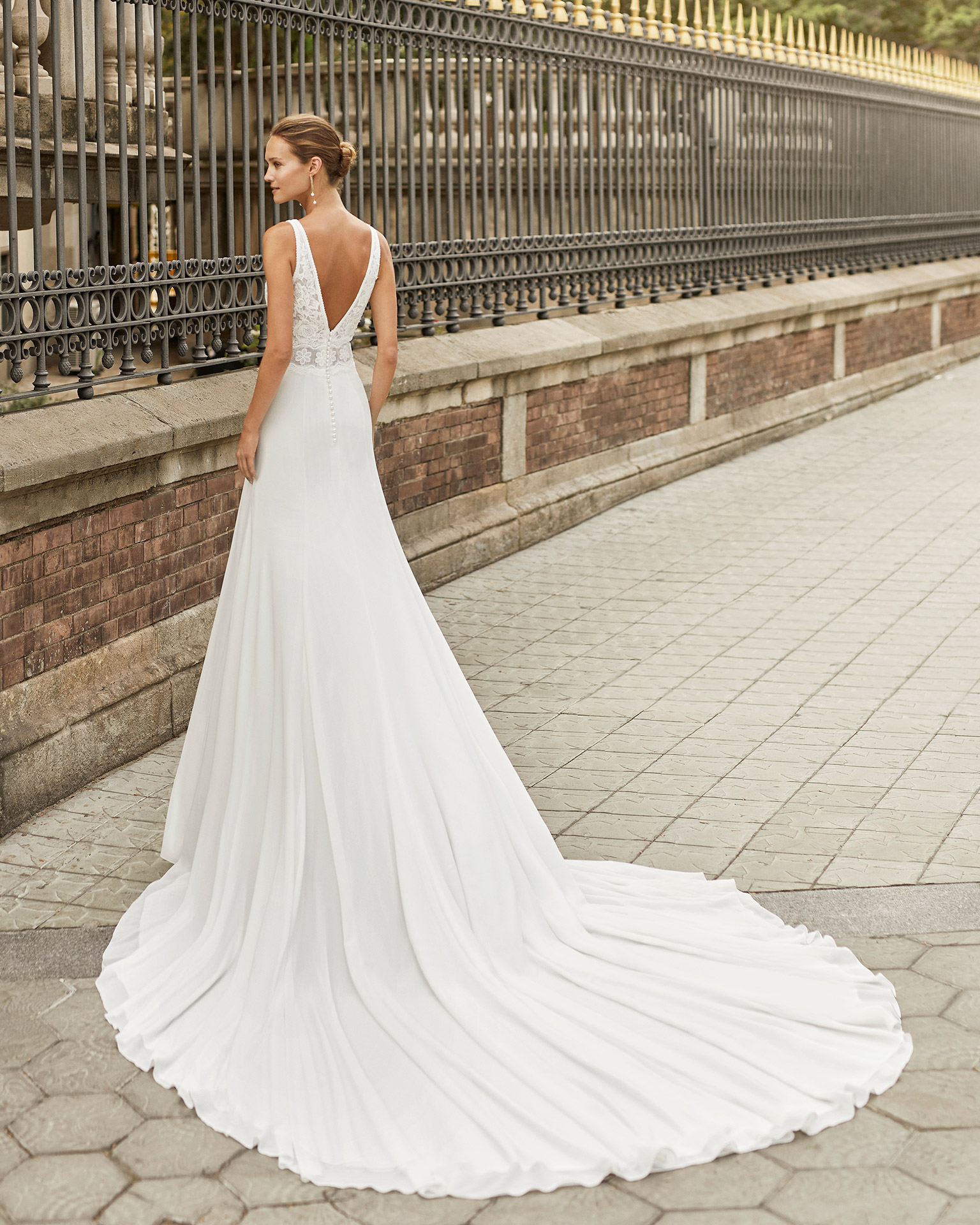 Lightweight wedding dress in georgette and lace. Deep-plunge neckline and V-back. 2022  Collection.