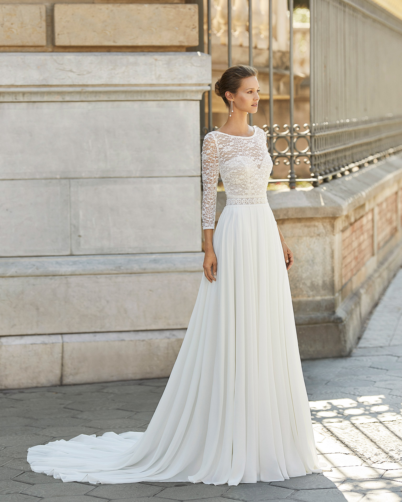Lightweight wedding dress in georgette and beaded lace. Boat neck, V-back and 3/4-length sleeves. 2022  Collection.