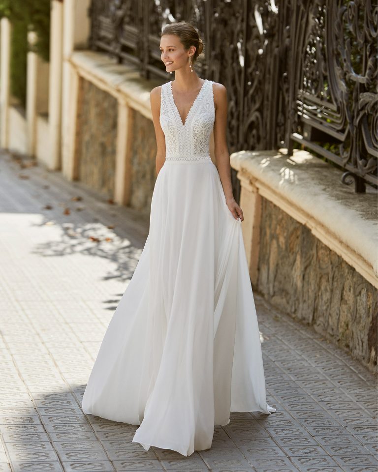 Lightweight wedding dress in voile and lace, beaded neckline, back and waist. V-neck and open back. 2022 Collection.