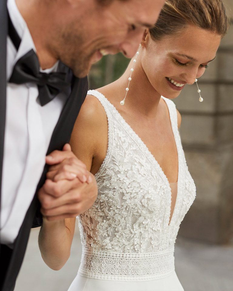Lightweight wedding dress in georgette and beaded lace. Deep-plunge neckline and V-back. 2022  Collection.