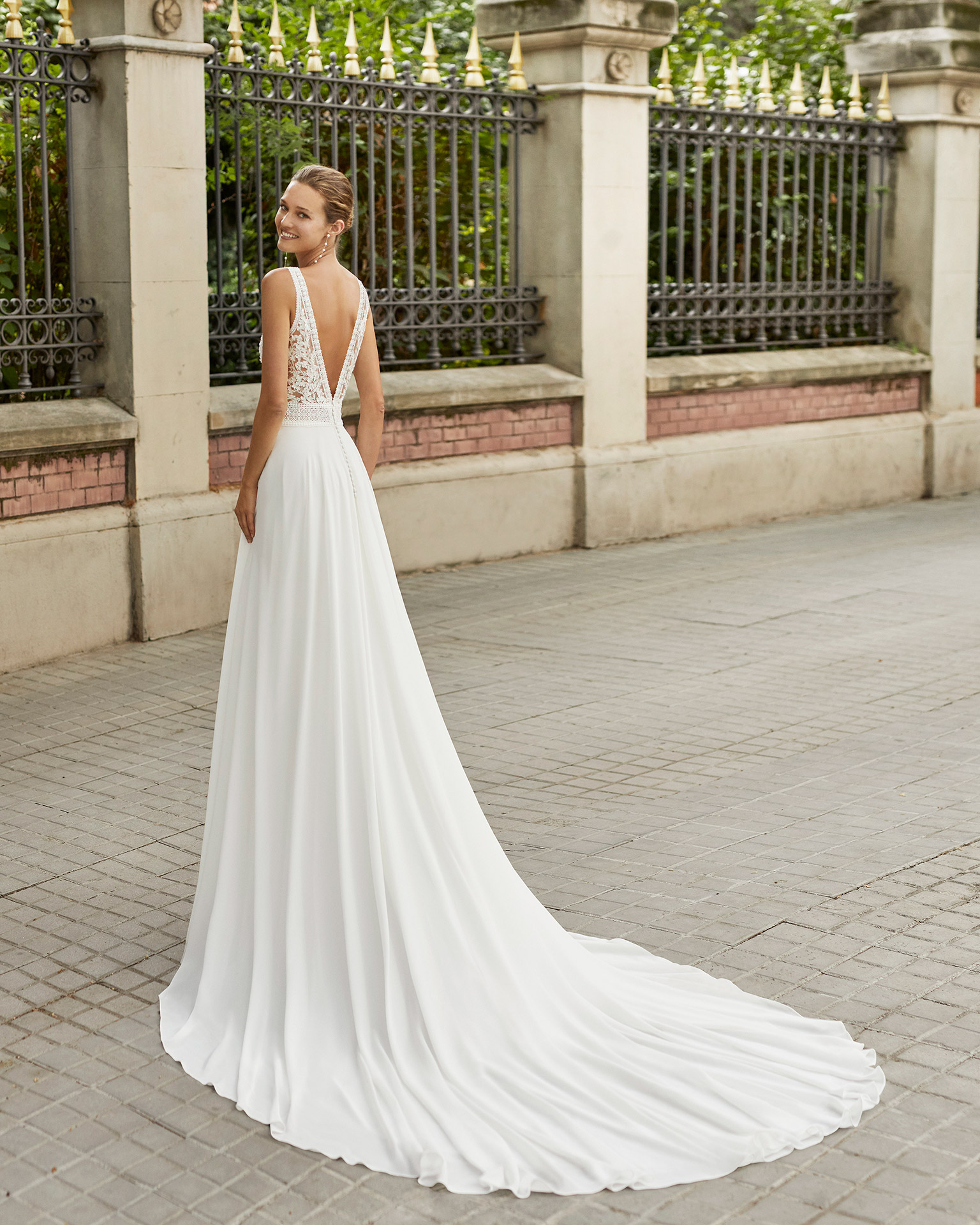 Lightweight wedding dress in georgette and beaded lace. Deep-plunge neckline and V-back. 2022  Collection.