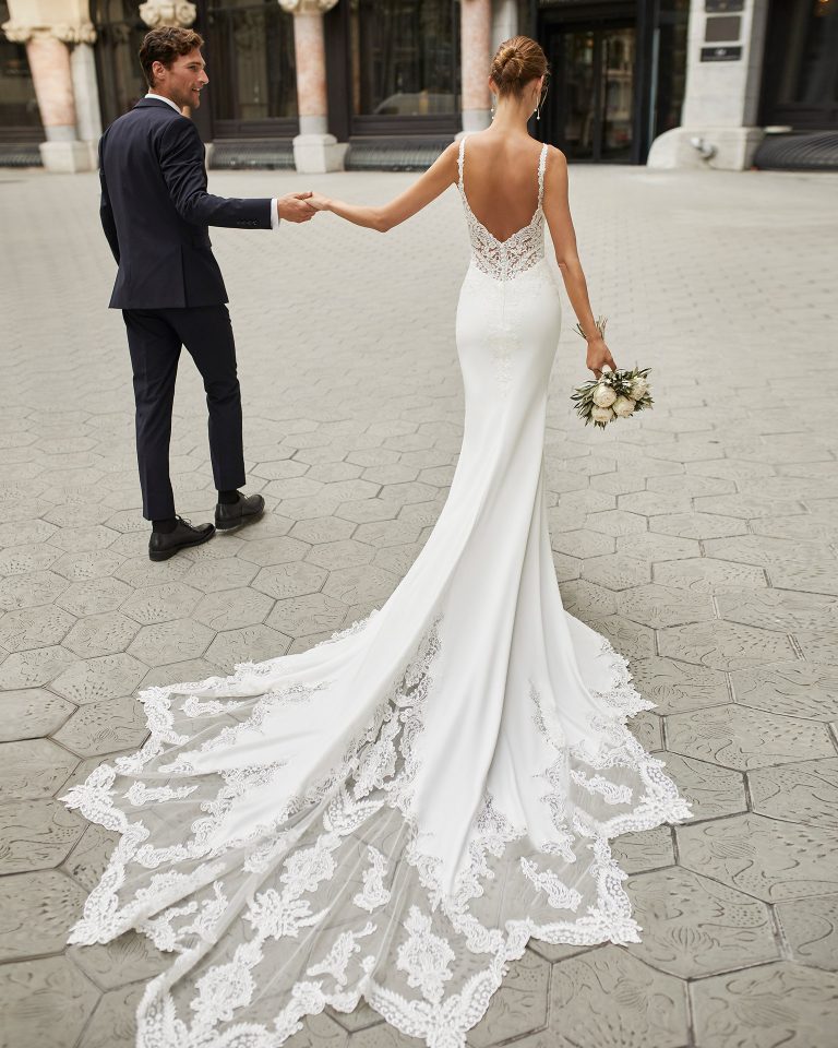 Mermaid wedding dress in stretch crepe with shaping lining and beaded lace. V-neckline and low back. 2022 Collection.