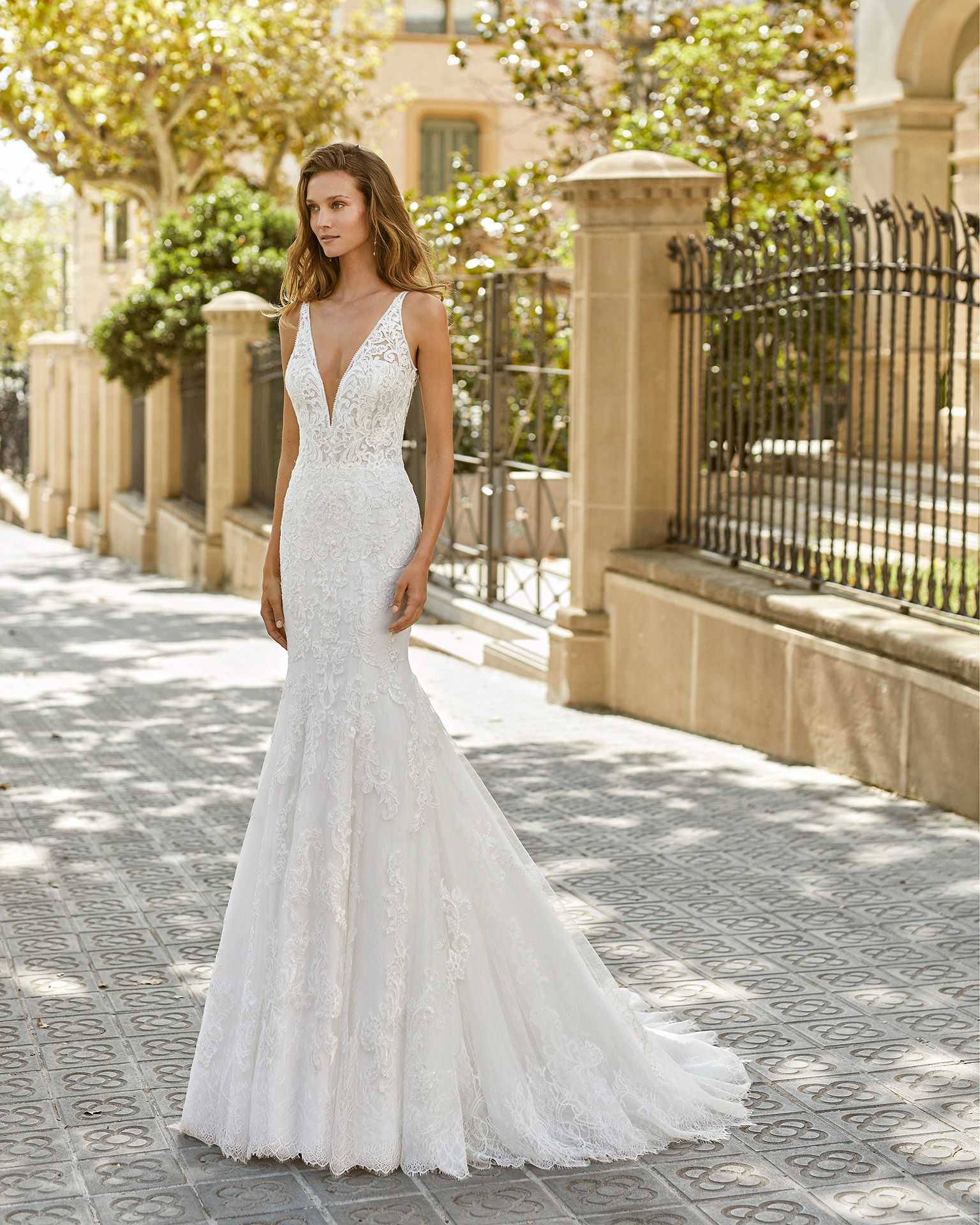 Mermaid wedding dress, beaded lace. Deep-plunge neckline, back with lace appliqué. 2022  Collection.