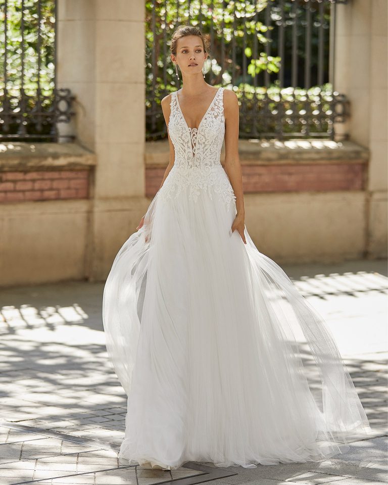 Romantic wedding dress, soft tulle and beaded lace. Deep-plunge neckline and V-back. 2022 Collection.