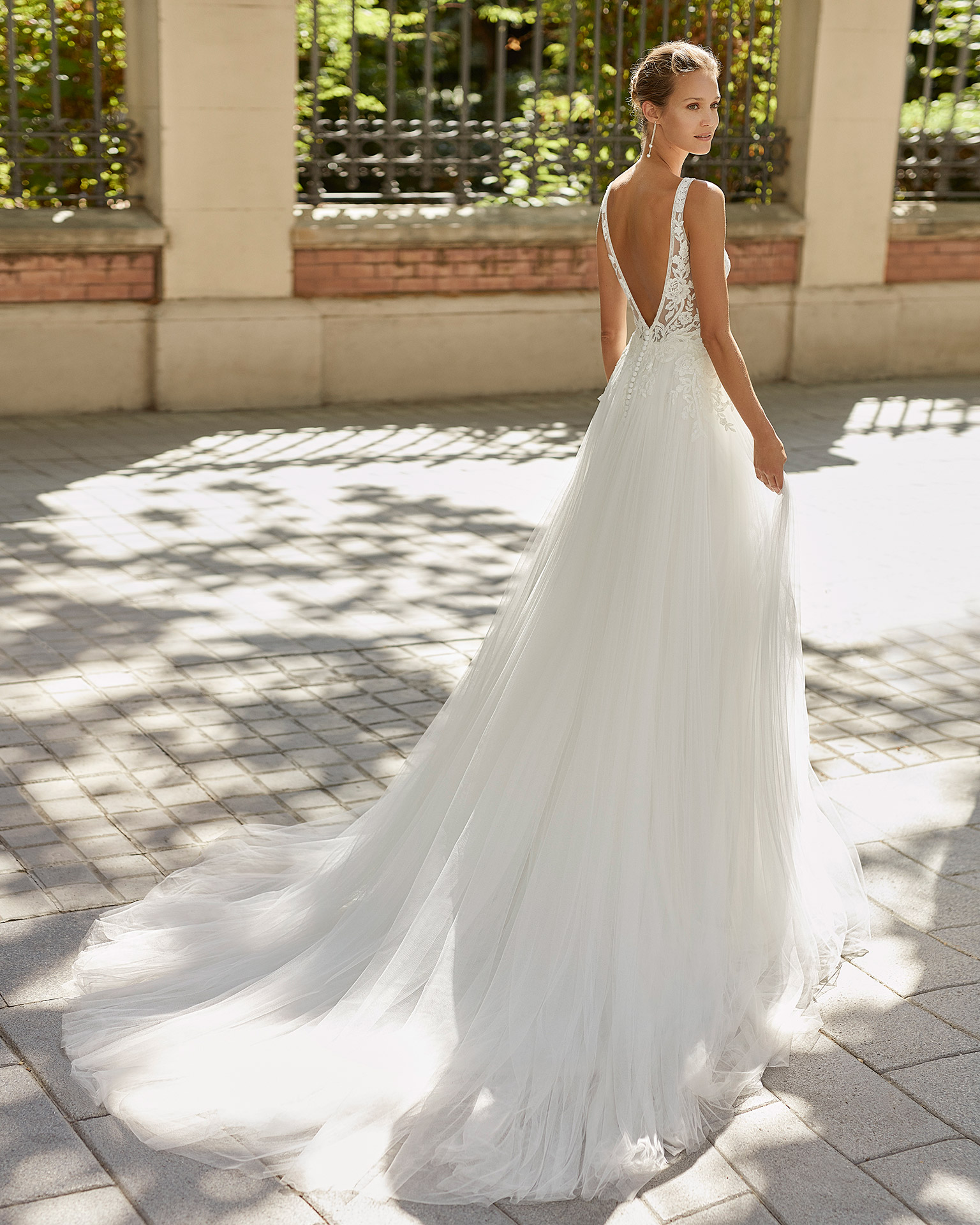 Romantic wedding dress, soft tulle and beaded lace. Deep-plunge neckline and V-back. 2022  Collection.