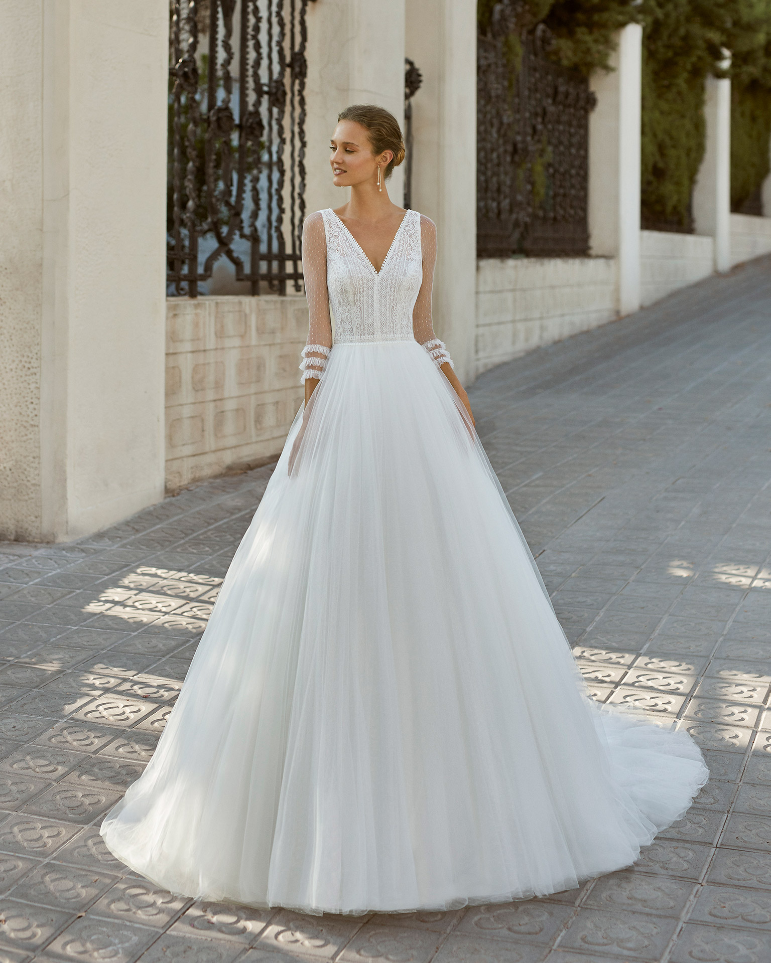 Romantic wedding dress, tulle and dot tulle underskirt, lace and beaded waist. V-neck and V-back with 3/4-length dot tulle sleeves. 2022  Collection.