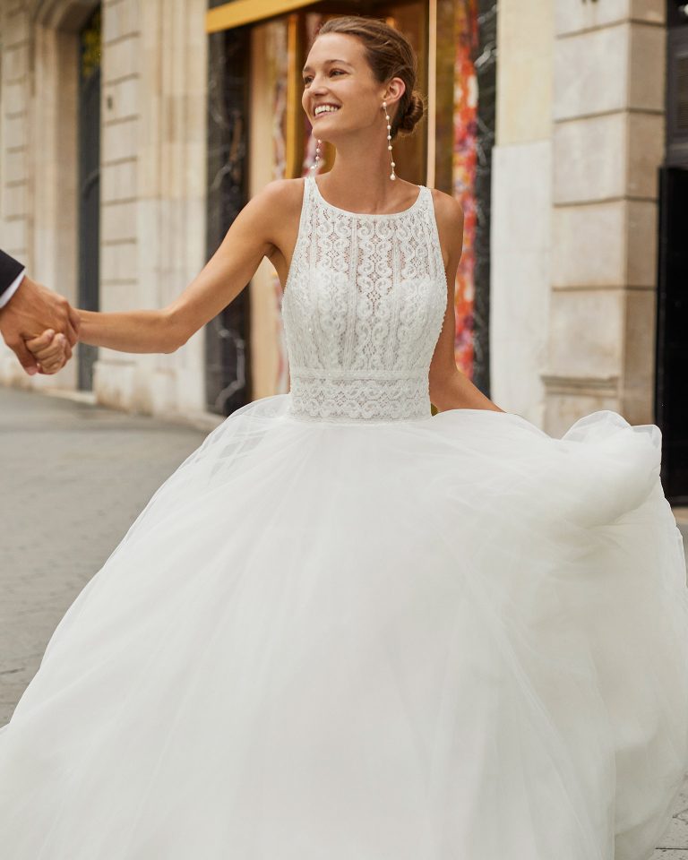 Romantic wedding dress, tulle and beaded lace. Boat neck, crossed back straps. 2022 Collection.