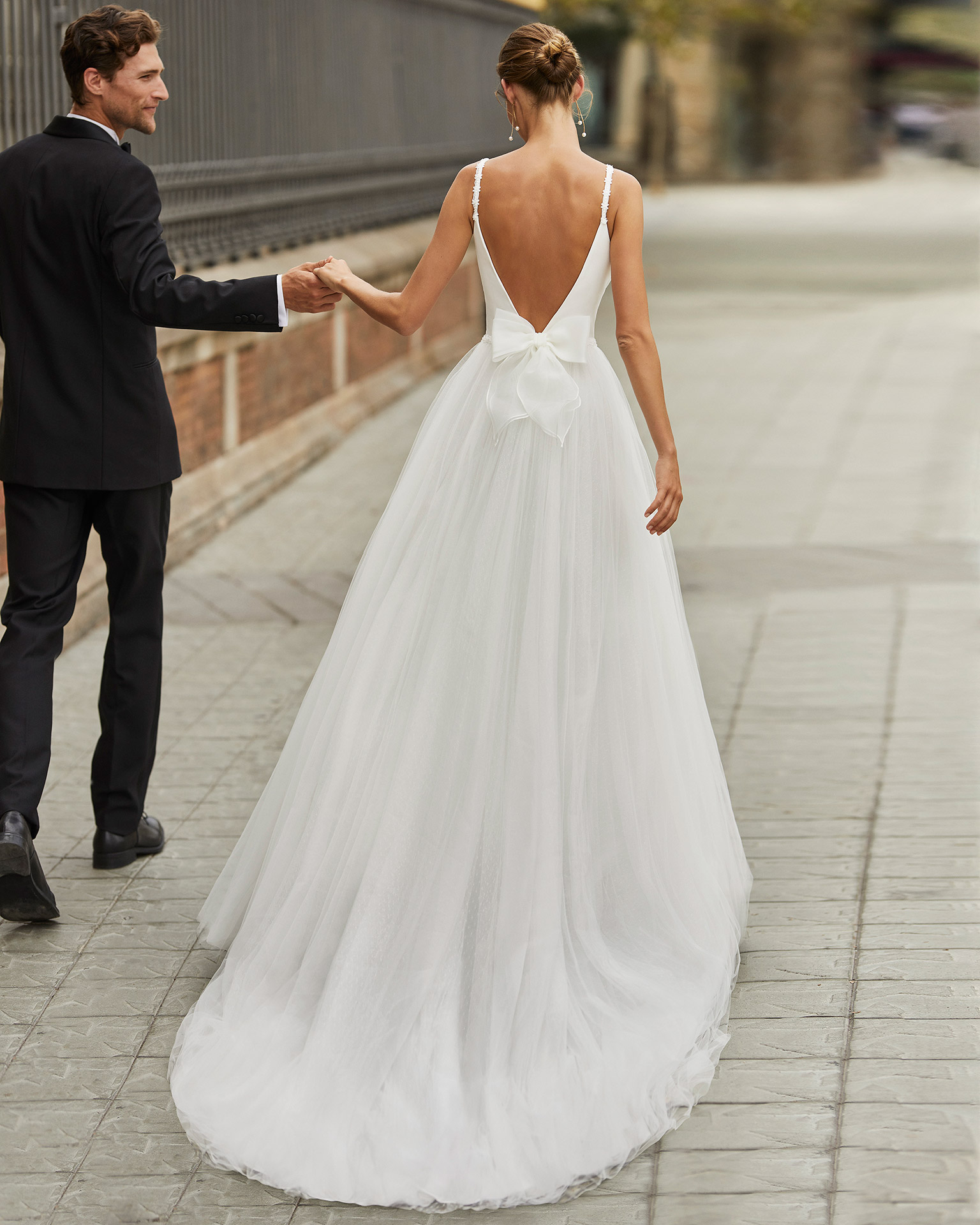 Princess wedding dress, tulle and dot tulle underskirt, crepe and beaded straps and waist. Deep-plunge neckline and low back. 2022  Collection.