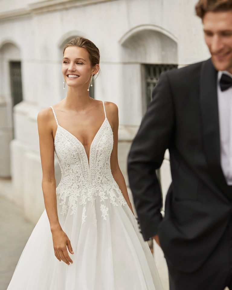 Elegant wedding dress, tulle and beaded lace. Deep-plunge neckline and V-back. 2022 Collection.