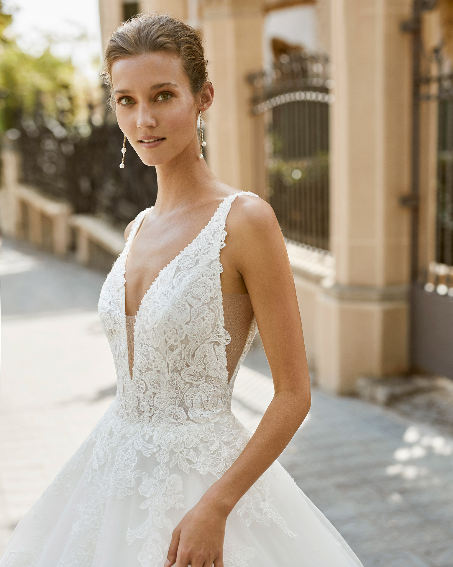 A line wedding dress, tulle, lace and beaded neckline and armholes. Deep-plunge neckline and V-back. 2022  Collection.