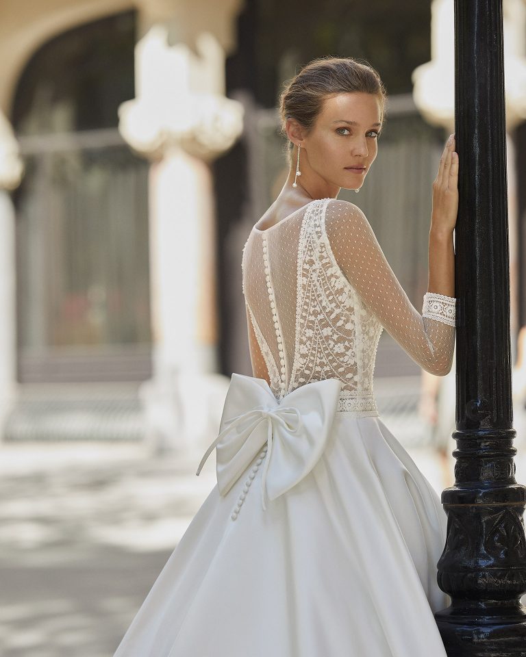 Classic wedding dress, satin, beaded lace. Deep-plunge neckline, dot tulle back and 3/4-length dot tulle sleeves. 2022 Collection.