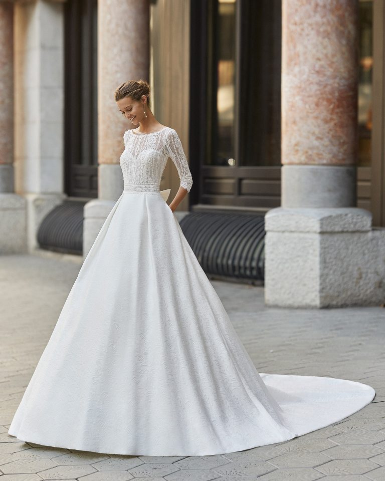 Classic wedding dress, brocade, beaded lace. Boat neck, V-back and 3/4-length sleeves. 2022 Collection.