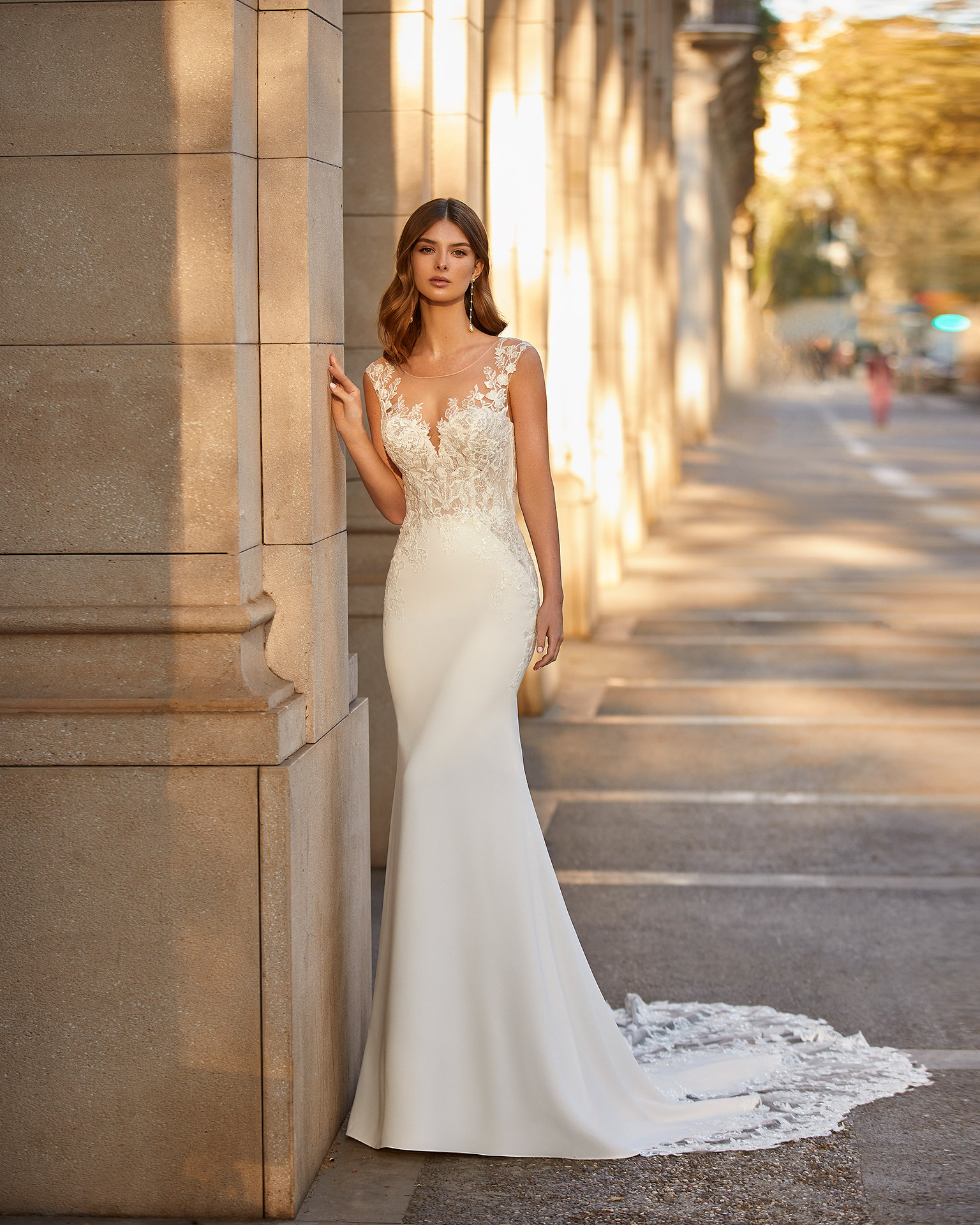 Romantic sheath-style wedding dress made of stretch crepe; with an illusion overlay over a sweetheart neckline, and a button-up sheer back. Unique Luna Novias outfit made of stretch crepe combined with beadwork lace. LUNA_NOVIAS.