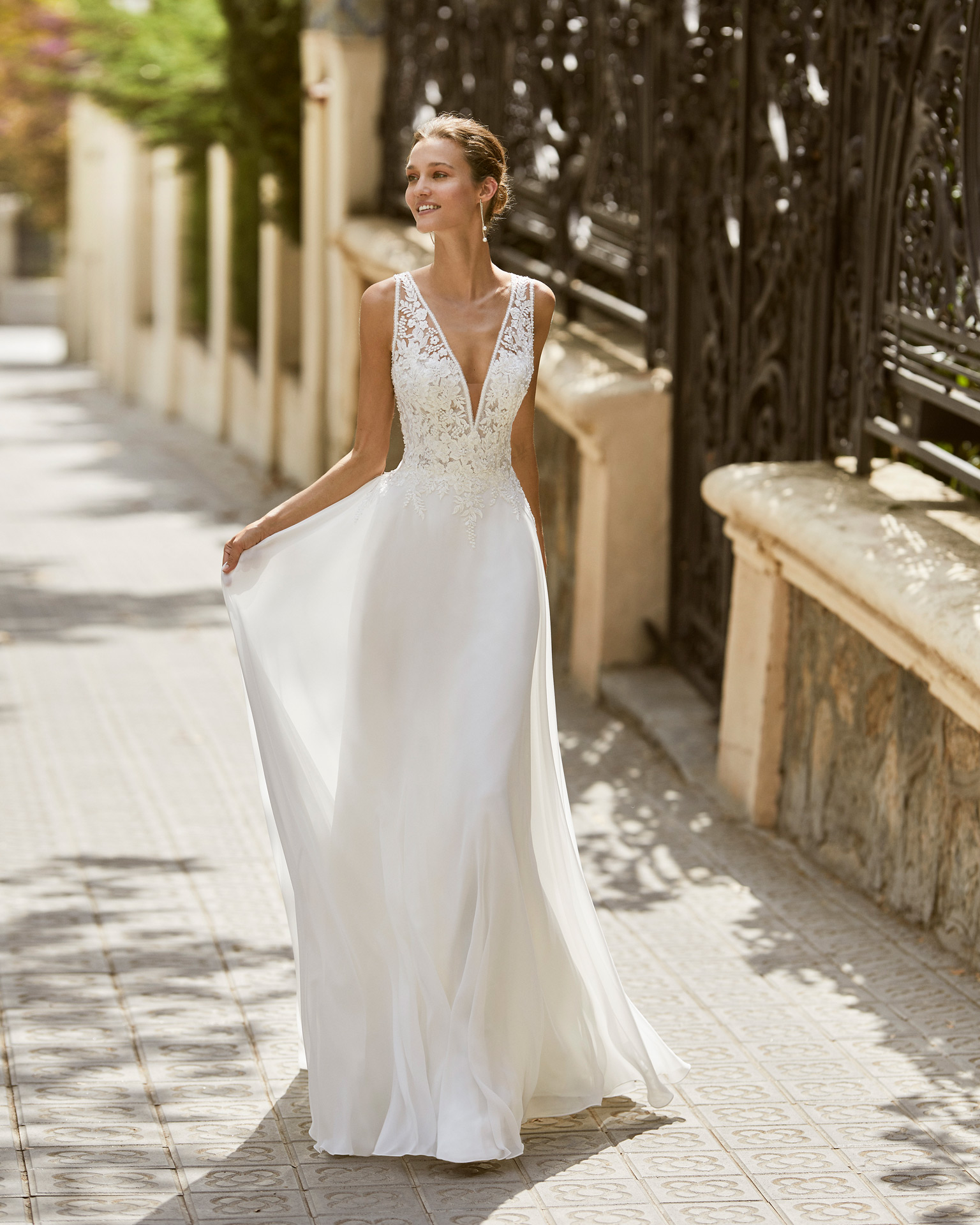 Lightweight wedding dress in voile and beaded lace. V-neck and lace appliqué back. 2022  Collection.