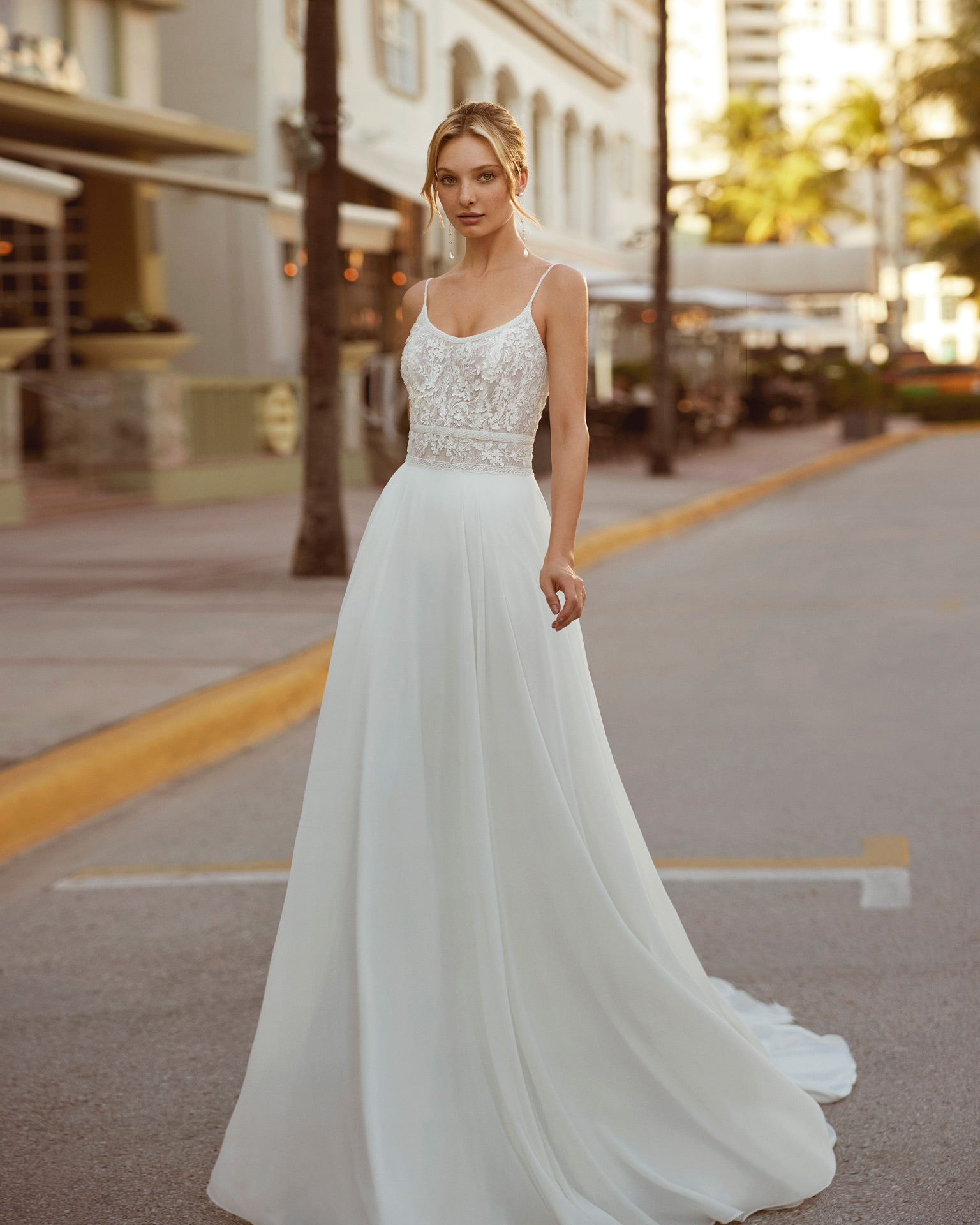 Princess-style A-line wedding dress, crafted in georgette. This Luna Novias dress is guaranteed to leave you captivated, with its round neckline and open back with straps. LUNA_NOVIAS.
