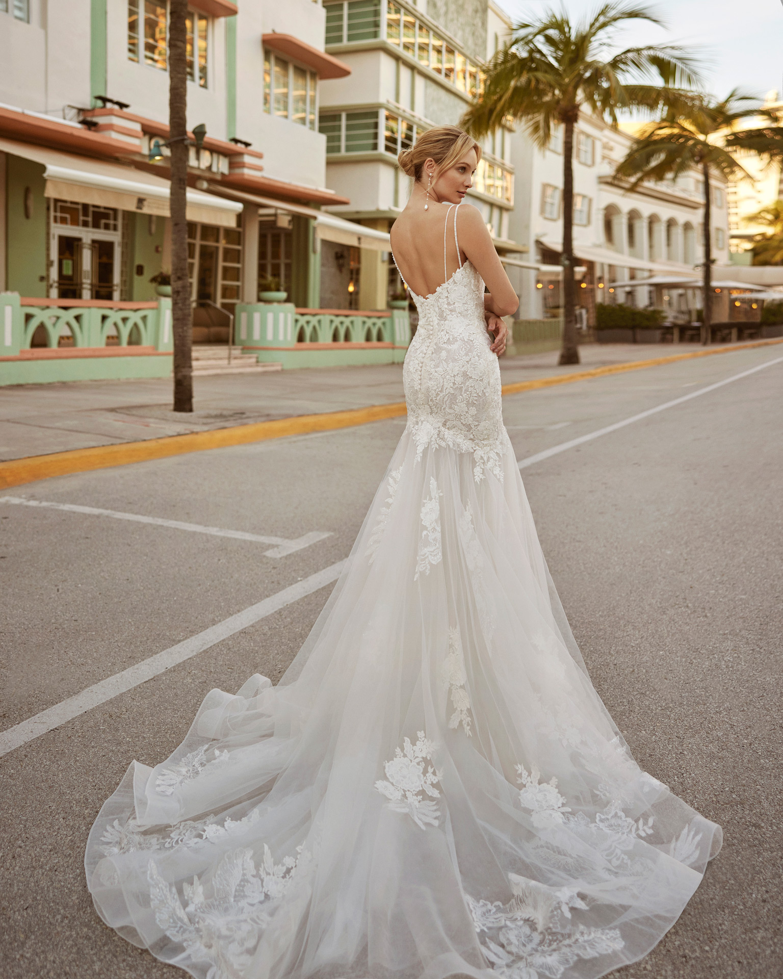 Sexy mermaid wedding dress, made in lace and beadwork. This delicate Luna Novias design features a V-neckline, open back and straps. LUNA_NOVIAS.