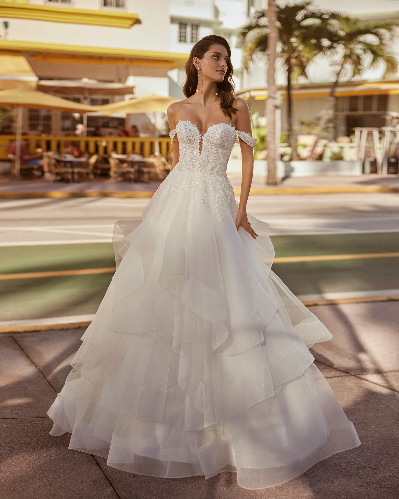 Classic princess wedding dress. Crafted in tulle, the gown features a sweetheart neckline, buttoned back, and detachable straps. Showcase the lace and beadwork bodice of this delicate Luna Novias design. LUNA_NOVIAS.