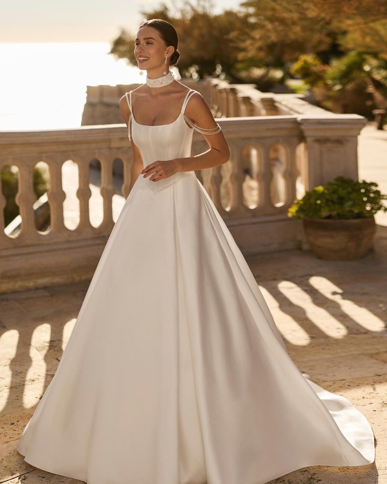 A-line wedding dress in mikado with square neckline, open back and jeweled straps. Features choker LUNA_NOVIAS.